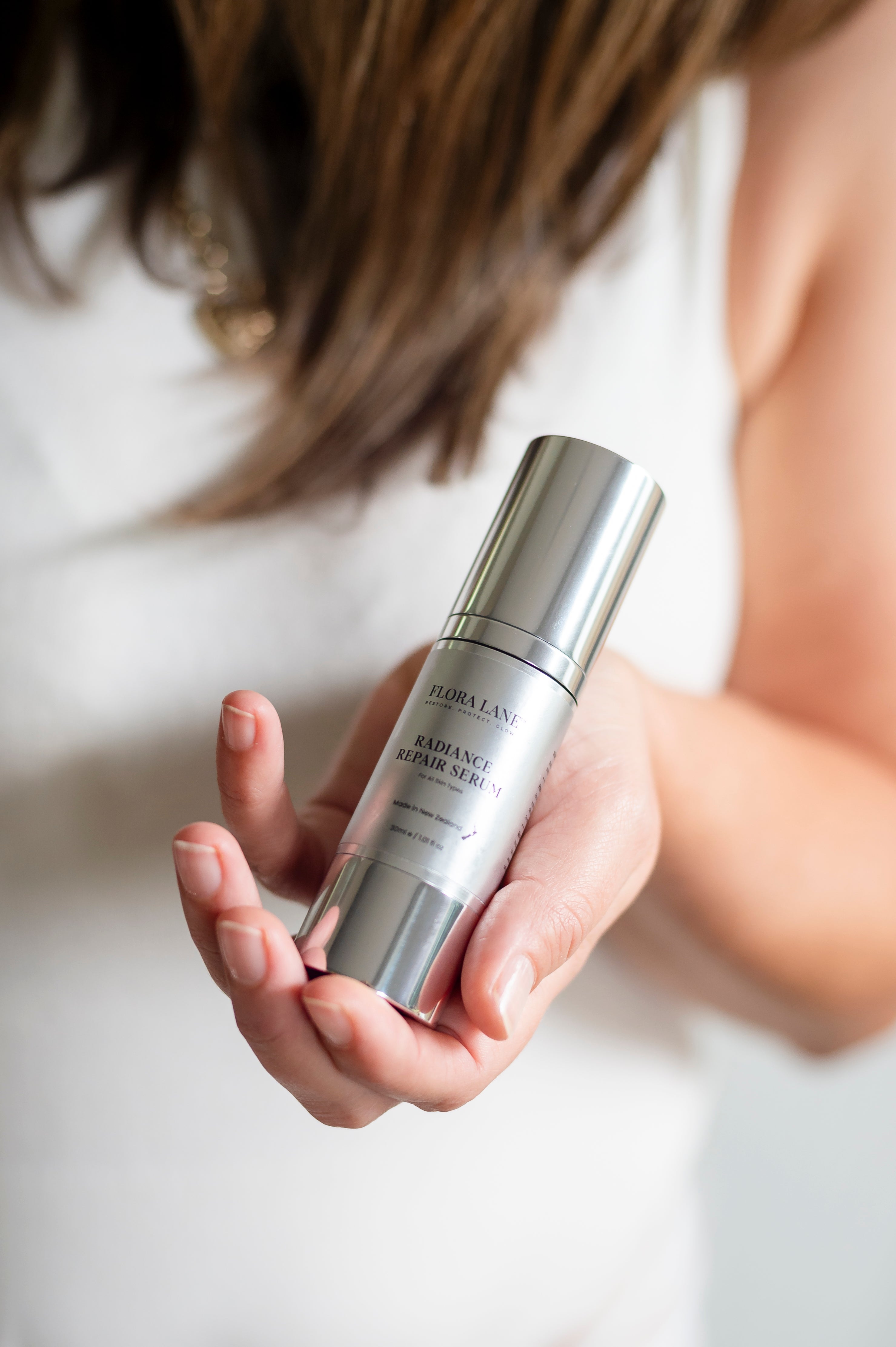 Flora Lane Radiance Repair Serum applied to skin